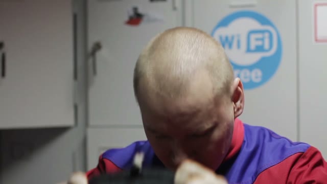 Man Puts On Helmet