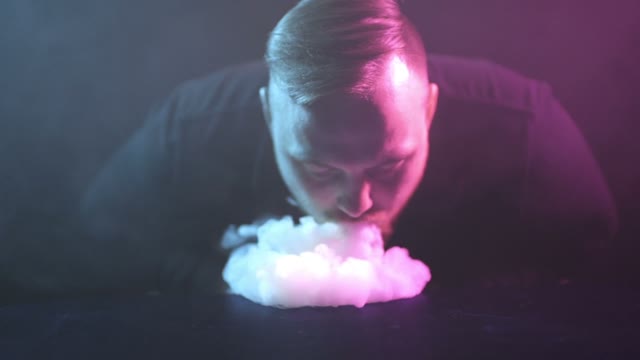 Man Breathes Out Smoke