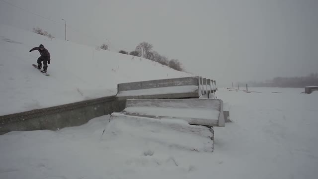 Snowboarder Slide On The Concrete Block