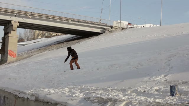 Snowboarder Jumping Over The Street Gap