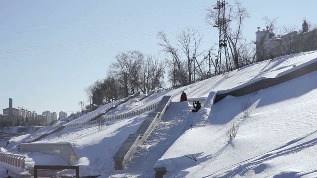 Skier Doing A Slide Trick On A Ledge In The Street