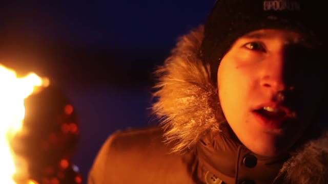 A Young Guy With The Torch Fearfully Looking At The Camera