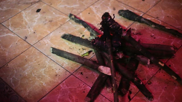 Someone Throws A Torch On The Floor In A Heap Of Burnt Torches