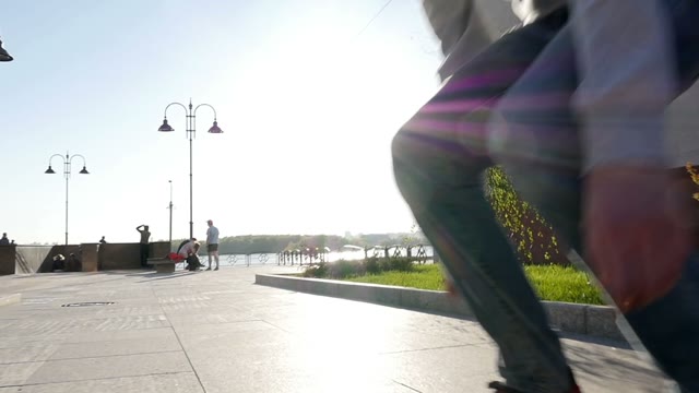 Skateboarder Does Trick At Sunset