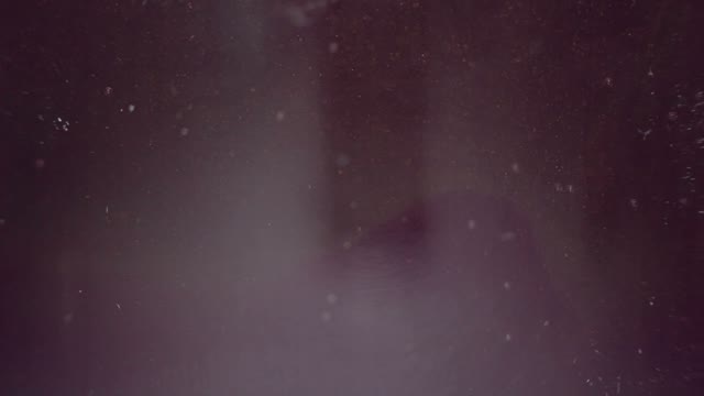 Particles Of Yellow And Purple Paint