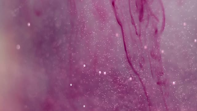 Purple Paint Particles In Water