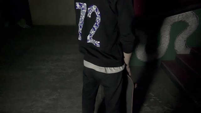 Skateboarder Posing In The Indoor Skate Park