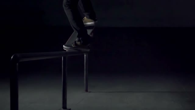 Skateboarder Slide On The Rails