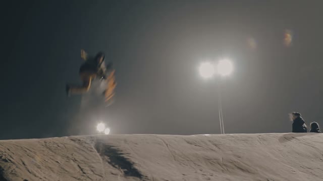 Snowboarder Doing Trick On The Slope