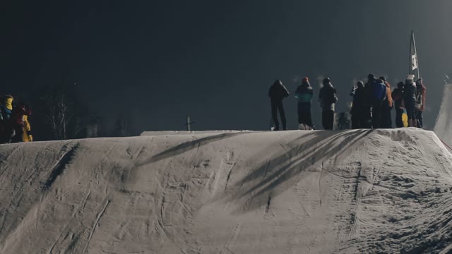 Snowboarder Doing Trick On The Slope