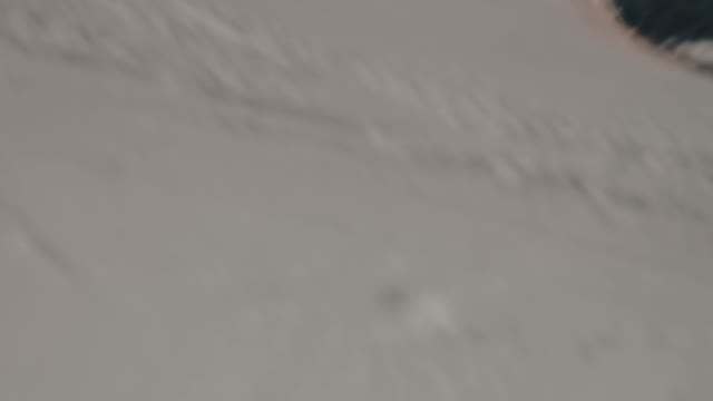 Snowboarder Rides Closeup