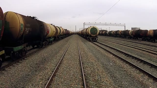Quadrocopters Flying Between Two Trains Trains