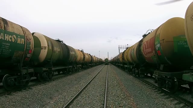Quadrocopters Flying Between Two Trains