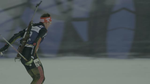 Biathlete Skiers Rides On The Slope