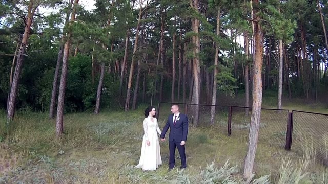 Couple Waving Their Hands In The Camera