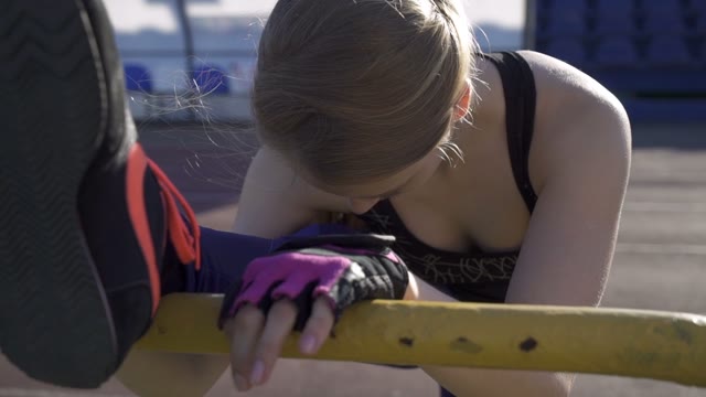Young Athlete Woman Warming Up In The Stadium