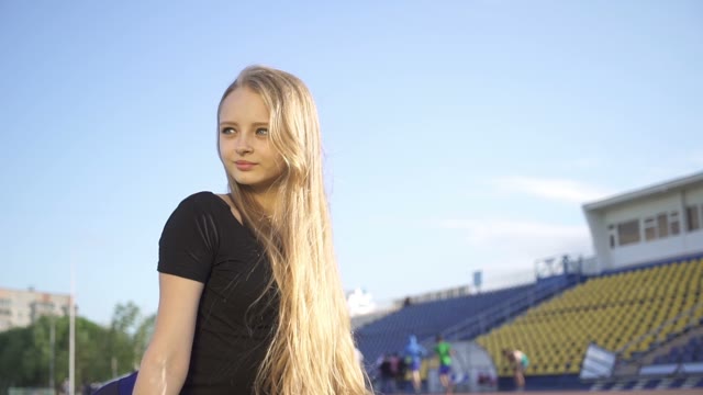 Young Female Athlete In The Stadium