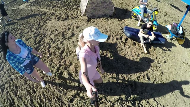 Two Young Girls Shoot Video Selfie-stick On The Beach
