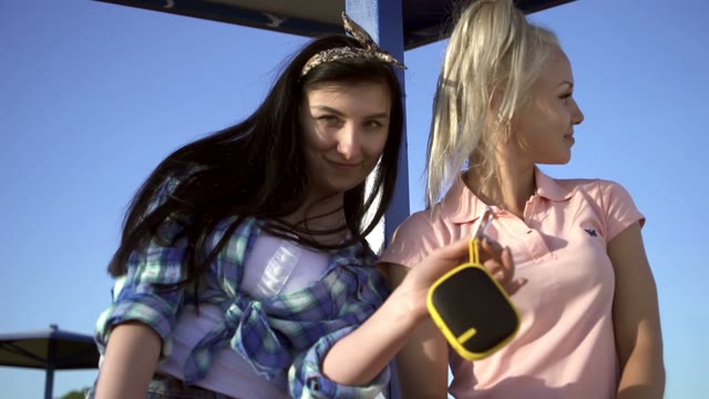 Two Beautiful Girls Dancing On The Beach