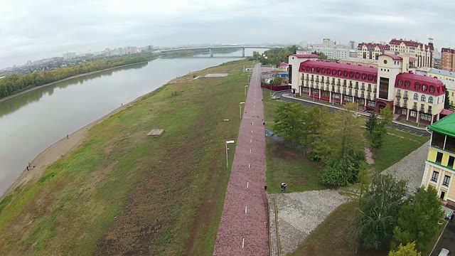 Quadrocopters Shoots Video Pedestrian Street Along The River