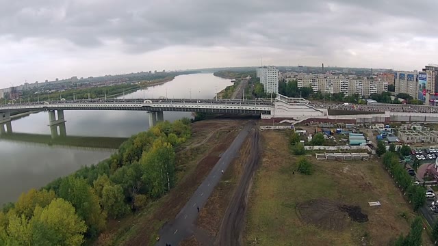 People Run A Marathon On A Large Bridge Across The River