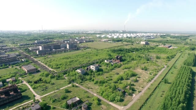 Quadrocopters Flying Over A Large Plant