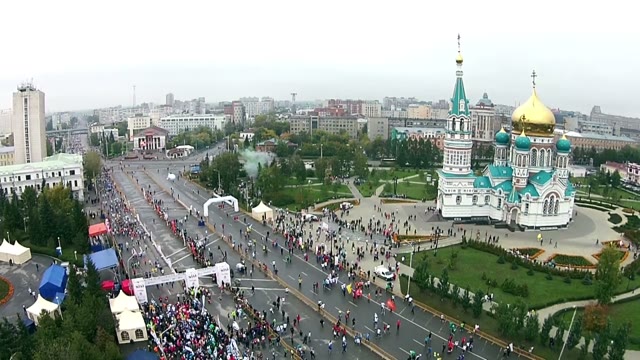 Young People Run A Marathon On Street Car
