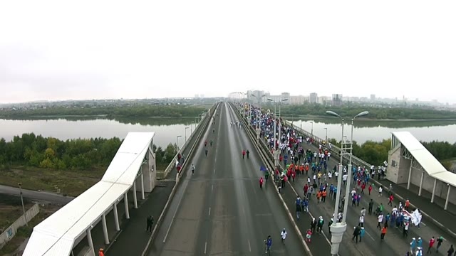 Young People Run A Marathon On The Road Bridge