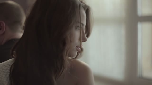 Young Beautiful Woman Close Up. Behind The Back Sits A Man