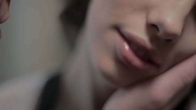 The Man Gently Touches The Woman's Face