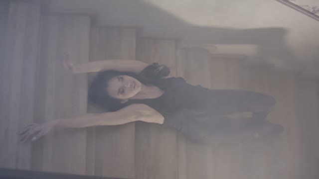 Young Woman Dancing Sitting On The Steps