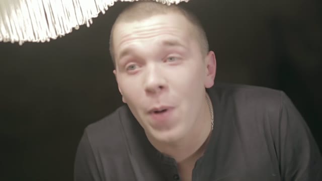 Young Man Emotionally Shouts And Gesticulates