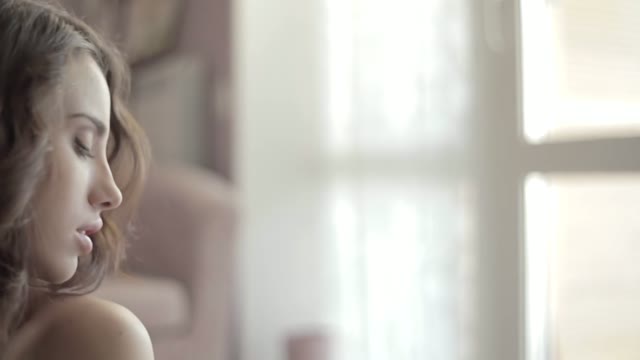 Close-up Of A Beautiful Woman. The Man Sitting Behind