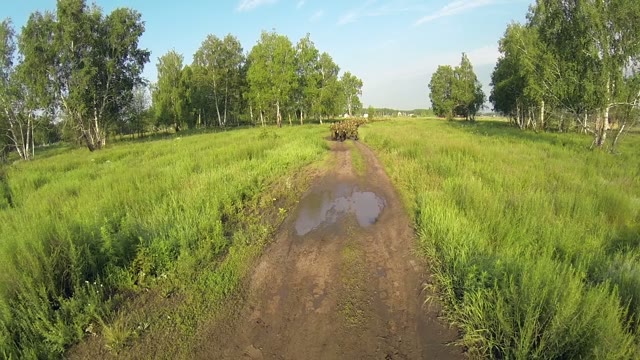 Soldiers Run On The Road In A Field