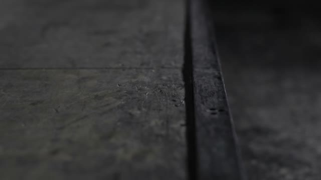 Man Is Trying To Do A Trick On A Skateboard On The Ledge And Falls