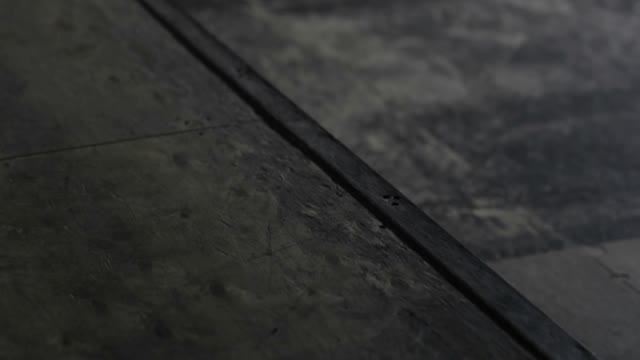Male Skateboarder Doing A Stunt On The Ledge