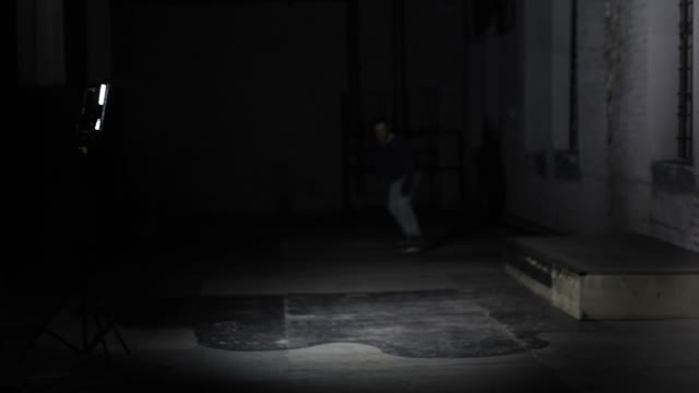 Male Skateboarder Doing A Stunt On The Ledge In The Skate Park