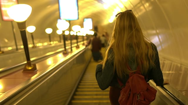 Pretty Young Woman Descends Into The Underground City