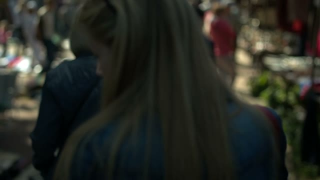 Attractive Young Blonde Woman Walking On The Street