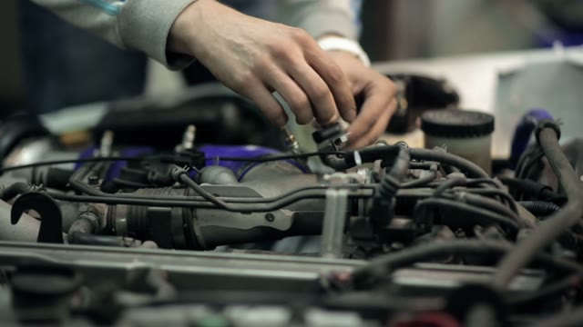 Mechanic Customizes The Engine In The Car, Close Up