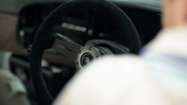 Mechanic Installs In Car Dashboard