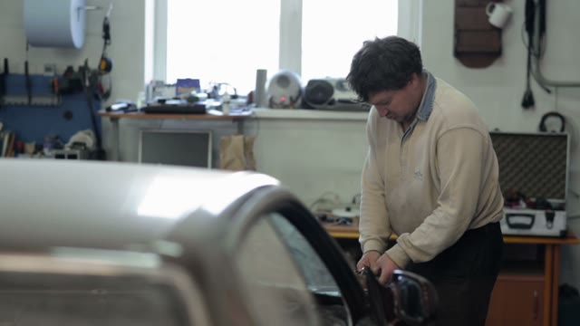 Mechanic Doing Work In The Repair Shop