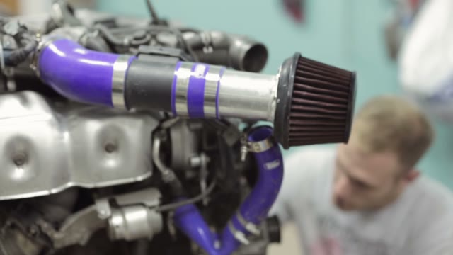 Young Mechanic Inspect The Car Engine