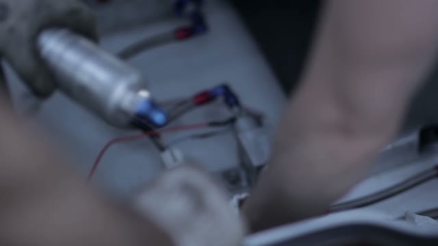 Mechanics Repairing Broken Car Parts