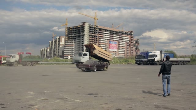 A Young Man Makes A Controlled Drift In Car