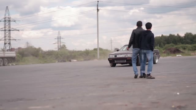 A Young Man Makes A Controlled Drift In Car