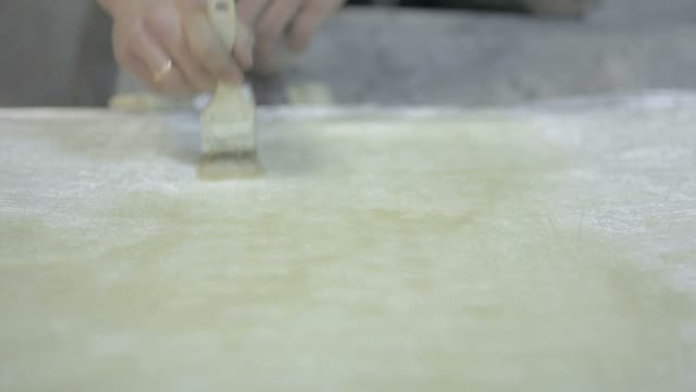 Man Gets The Varnish On The Surface Of The Item