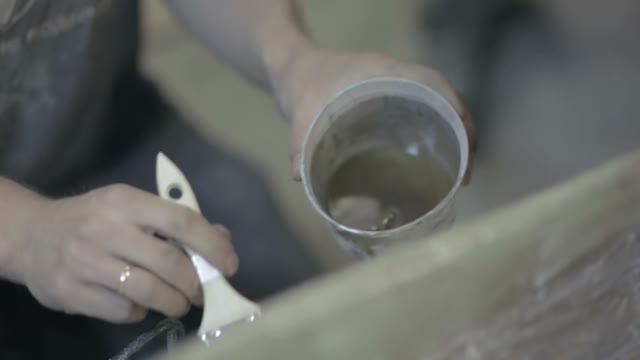 Worker To Put Varnish On The Surface Of The Item