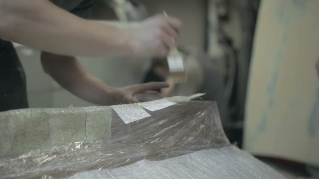 Young Worker Put Varnish On The Surface Of The Item