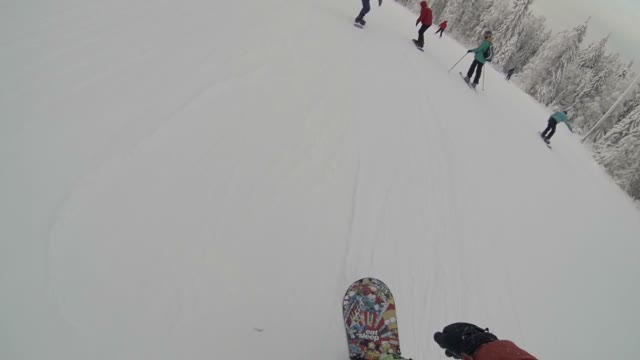 Young Skier Gives Five Sliding Down The Slope
